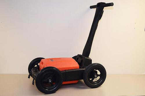"Cart with a GPR antenna. This photo shows the mobile walk behind pushing cart that can accommodate the GPR antennas and control panels. "